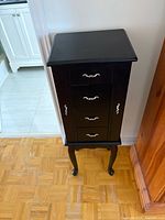 Front view showing drawers and legs