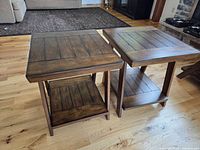 Two matching wood end tables full view showing tops and shelves