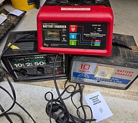 All three battery chargers with cords visible