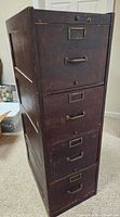 Full view of cabinet front showing five drawers and hardware