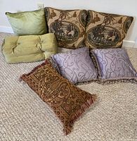 All seven pillows arranged on carpet