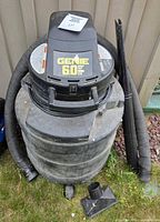 Front view of Genie shop vacuum showing brand logo and overall condition