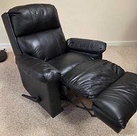 Front view of black leather Lane recliner with footrest extended