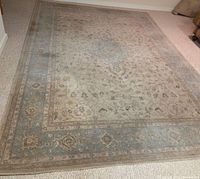 Full view of rug showing pattern and staining