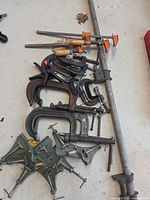 Pile of various clamps showing types and quantities