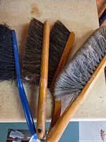 All four dust brushes laid side by side