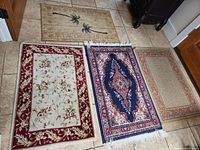 All four rugs laid out on floor