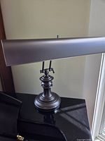 Full view of piano lamp showing overall style and finish