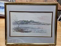 Full view of framed watercolor landscape