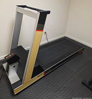 Full view of Precor treadmill on floor mat