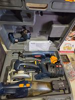 Overall kit in molded case showing all tools and charger