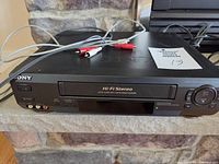 Front view of Sony SLV-N50 VCR with RCA cables on top
