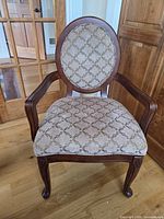 Front view of tan diamond pattern upholstered side chair