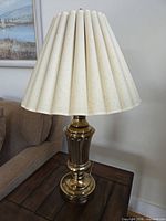 Full view of lamp with shade on side table