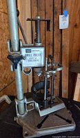 Full view of Sears Craftsman drill press bracket on base showing column, clamps and adjustment hardware