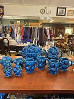 Full set displayed: teapot, tureen, creamer, sugar, six mugs, salt & pepper shakers