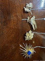 Front view of all four brooches