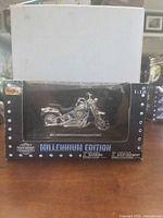 Front view of boxed Maisto Millennium Edition FXSTS model