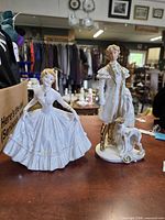 Front view of both porcelain figurines