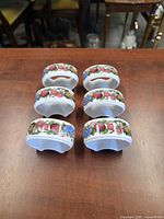 Top view of six Portmeirion Pomona napkin rings