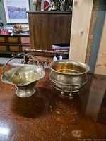 Both brass vessels side by side on table