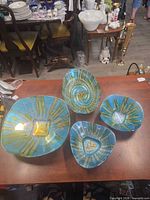 Top view of all four fused glass bowls displaying colors and patterns