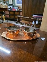 Creamer and sugar bowl on tray showing overall appearance