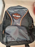 Front of Harley-Davidson backpack showing logo, front pocket, colors