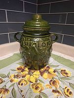 Full view of lidded green Scheurich Rumtopf jar