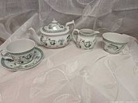 Group shot of all five Spode Gardening Green pieces