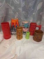 Group shot of all seven Tiki vessels showing colors, shapes and sizes