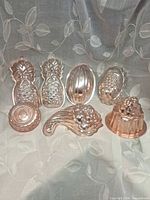 Group shot of all seven copper molds