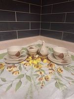 Full set on floral cloth showing all pieces