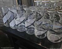 Front view showing all 12 Georges Briard swirl glasses in three height groups