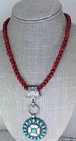 Red beaded necklace with floral turquoise pendant