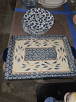 Top view of Temp-tations tray and stack of blue cherry plates