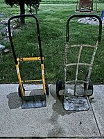 Front view of both hand trucks standing on pavement