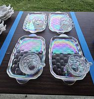 Complete view of four trays each paired with a cup