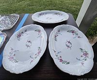 Three Wawel Rose Garden platters on table showing pattern and condition