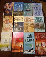 Front covers of all 12 paperbacks laid out in three rows