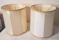 two matching cream drum lamp shades front view