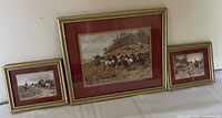 Front view of all three framed prints displaying artwork and frame design
