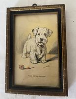 Front view of framed postcard showing artwork, caption, and signature