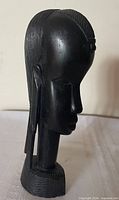 front-right view of ebony bust showing facial features and elongated neck