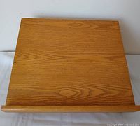 Top view showing oak surface and retaining lip