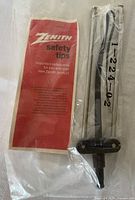Front view of sealed Zenith antenna showing red Safety Tips insert and part number