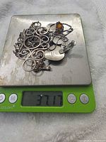 Entire lot on scale displaying weight 37.17 g