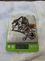 All jewelry pieces on digital scale reading 51.62 g