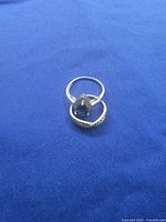 Top view of both rings showing blue center stone and band design