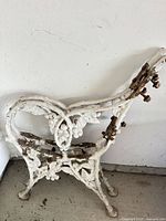 Full view of one ornate cast iron bench end